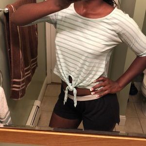 A partially cropped tshirt with a tie in front